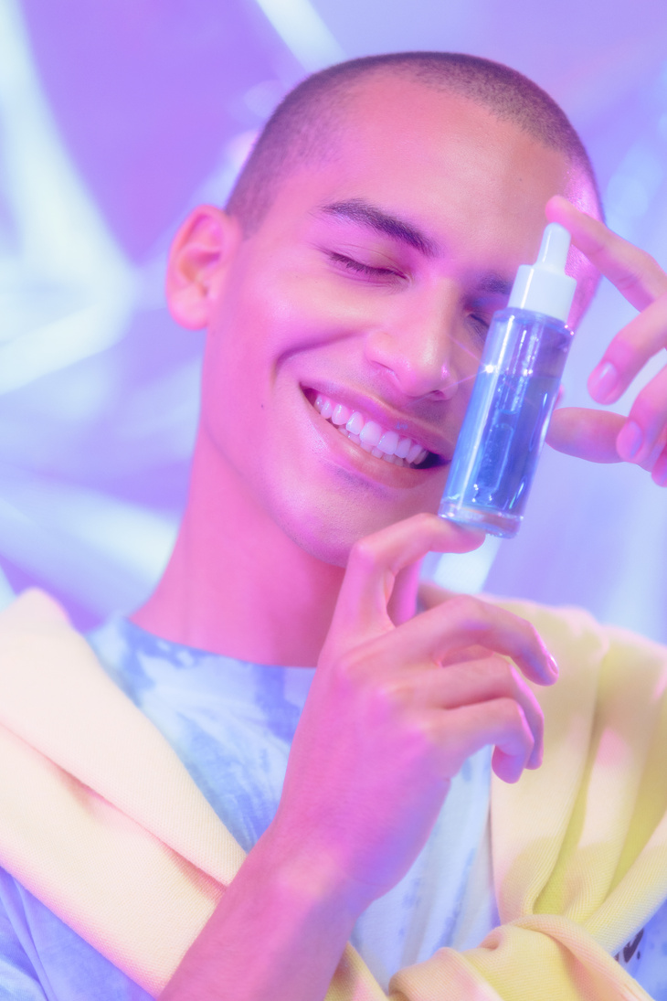 Man Holding Skincare Product